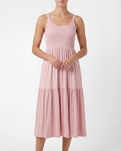 Pink dress worn by a person on a white background