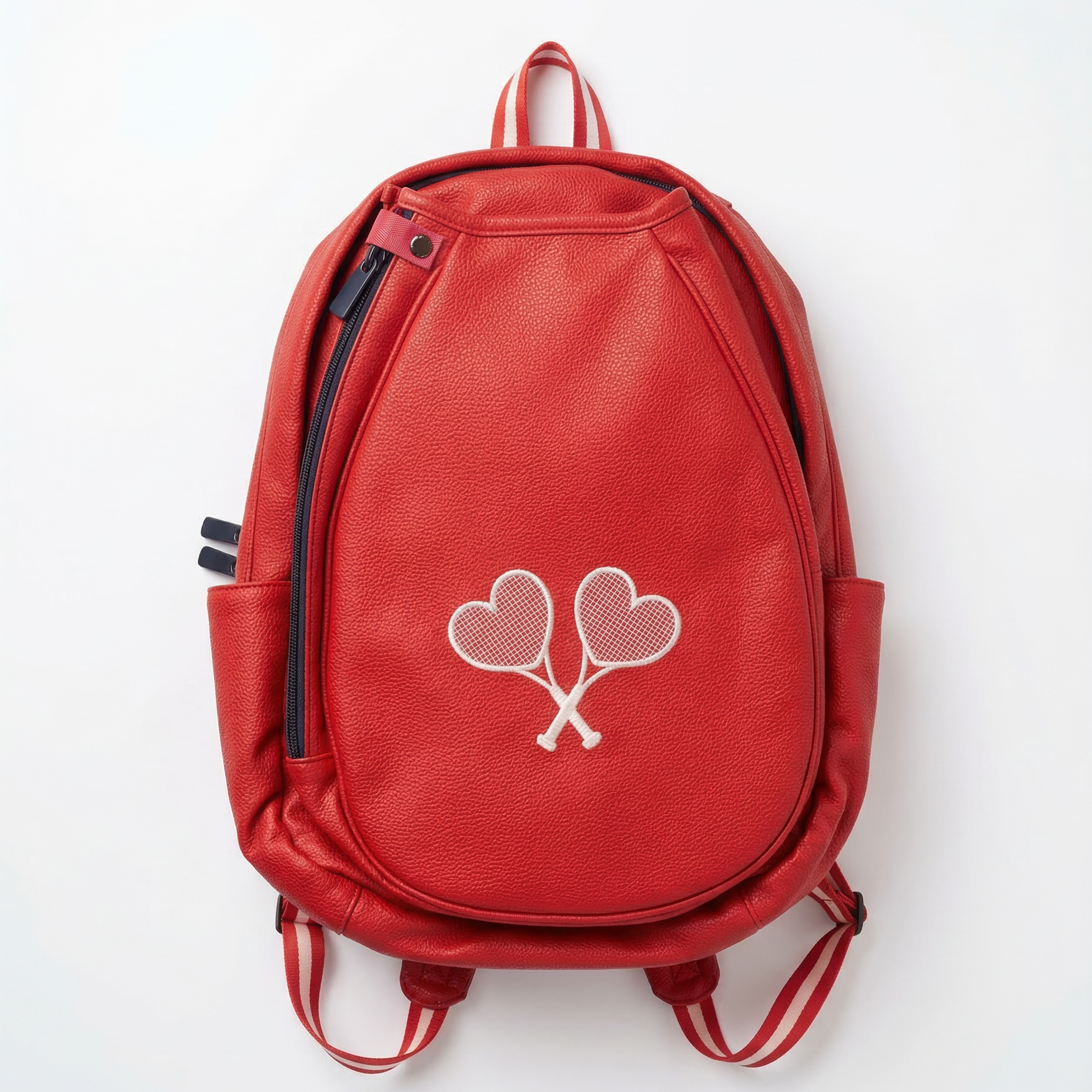 Red backpack with heart-shaped paddle design on a white background