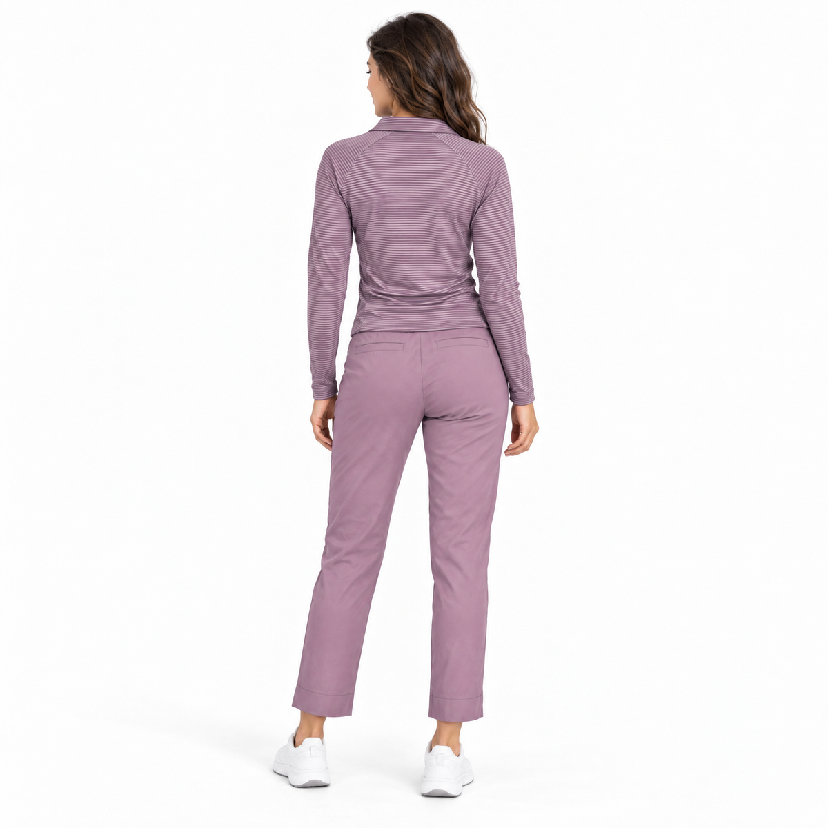 A woman viewed from the back wearing a matching mauve-purple long-sleeve collared top and straight-leg pants set, paired with white sneakers, against a plain white studio background.